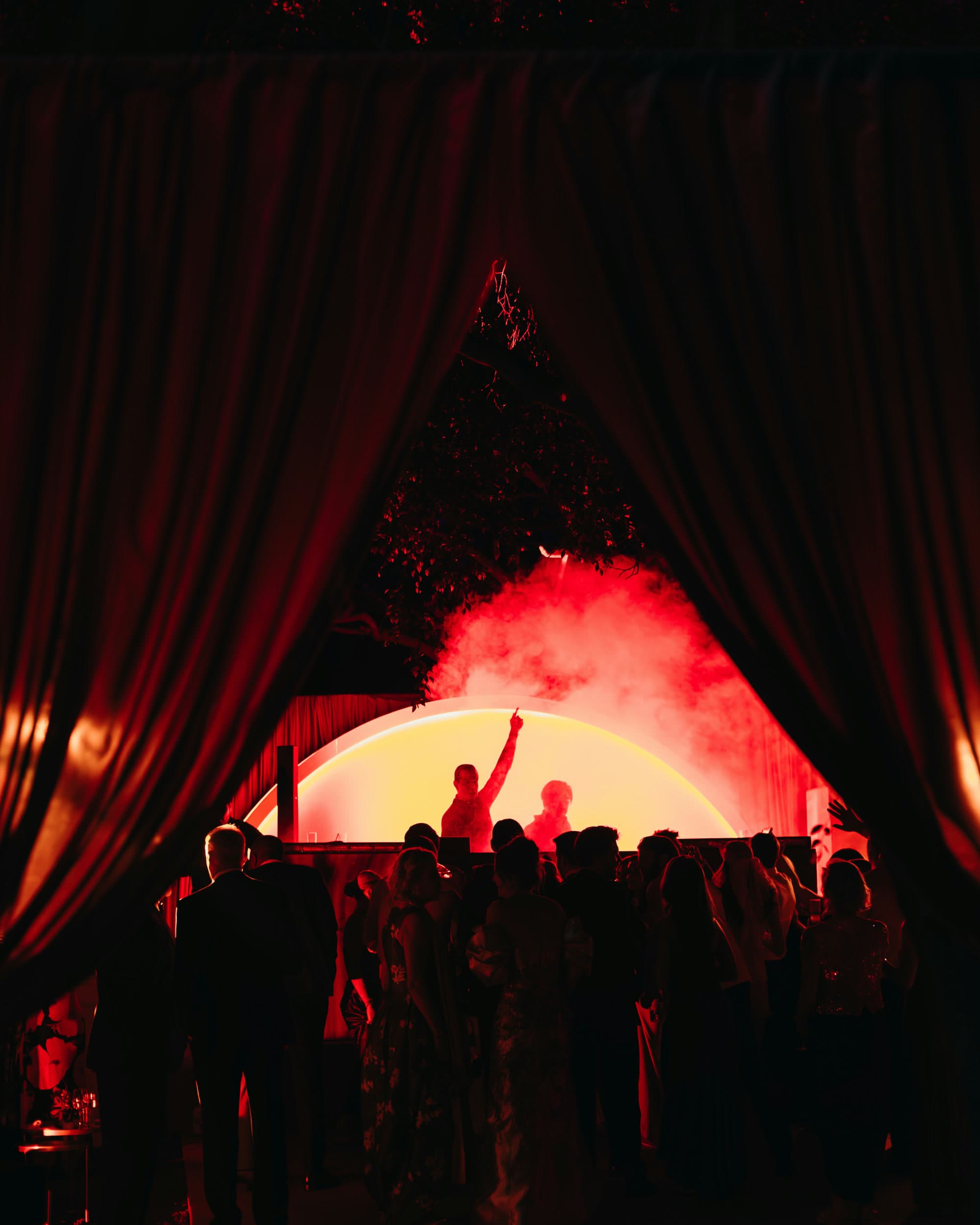 vbmusic DJ set behind red drapes at a marquee wedding